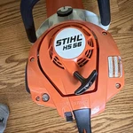 Stihl Hs 56 Gasoline Hedge Trimmer, Orange, Blade Cover Included. Fixed Price $465.00.